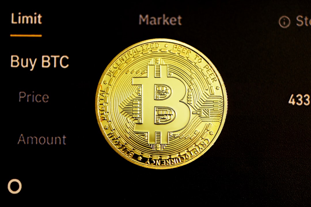 gold round coin on black surface