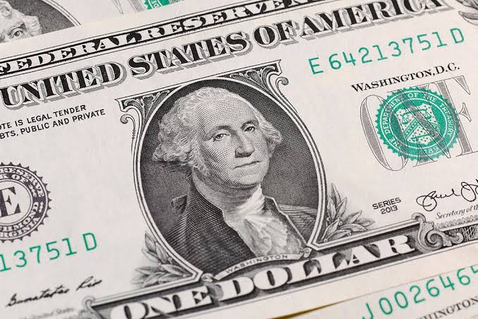 A close-up of Benjamin Franklin on a United States one hundred dollar bill