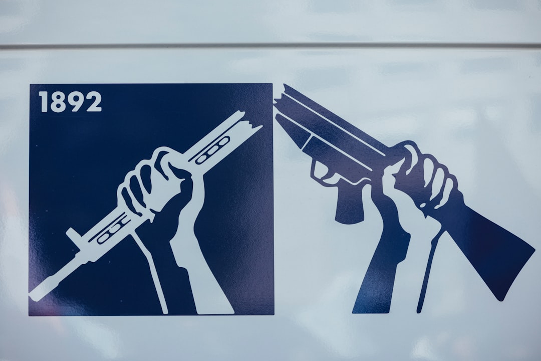 Two firearms are shown in silhouette.